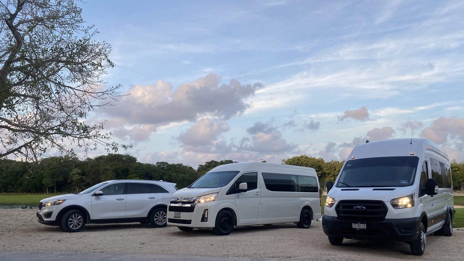 Our three private vehicles: Kia Sorento SUV, Toyota Hiace van and Ford Transit van
